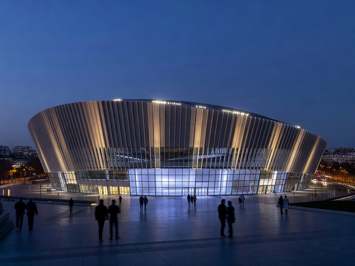 Parc des Princes stadium exterior under evening illumination in western Paris